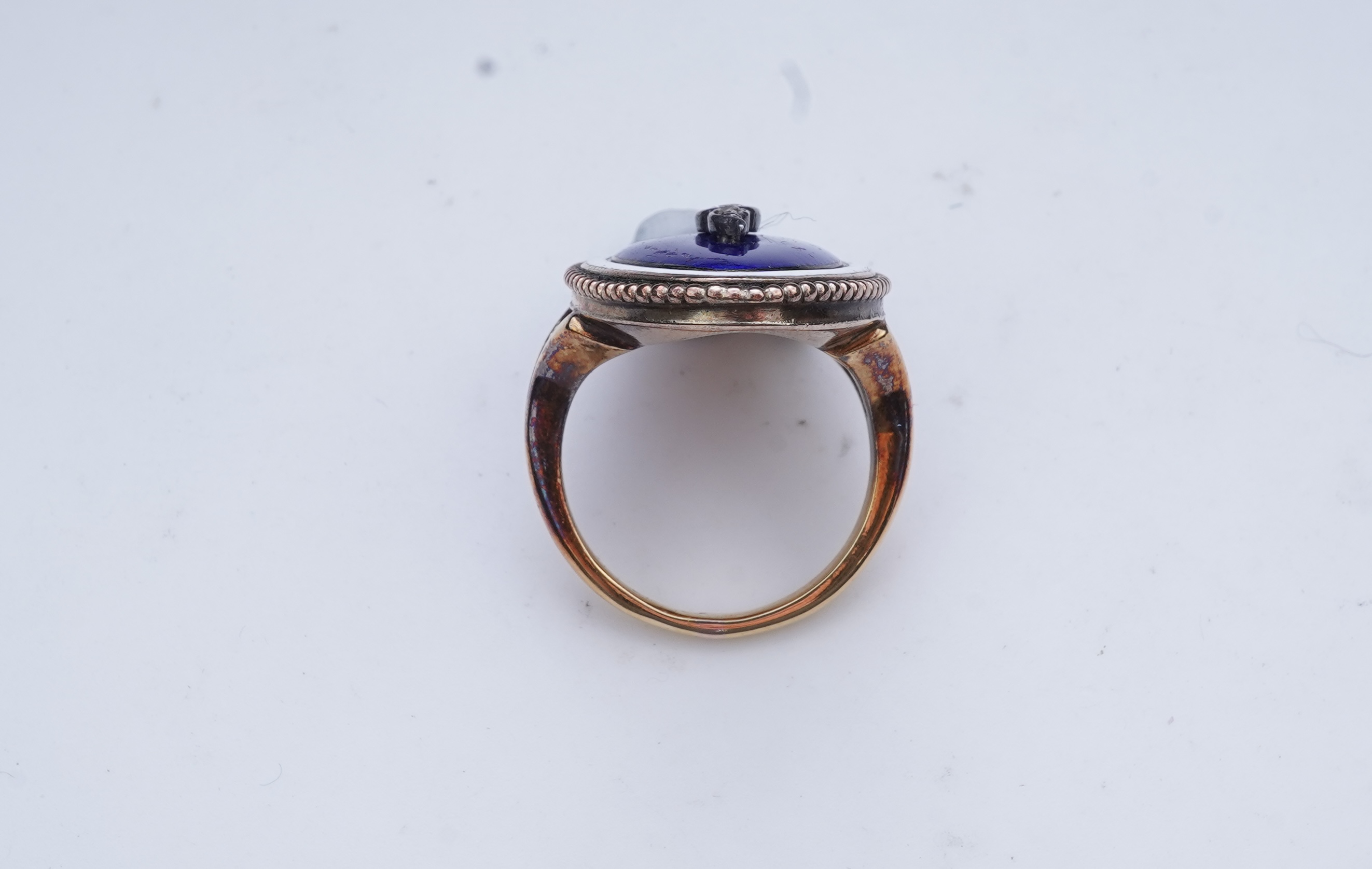 An enamel and diamond mourning ring, late 19th century